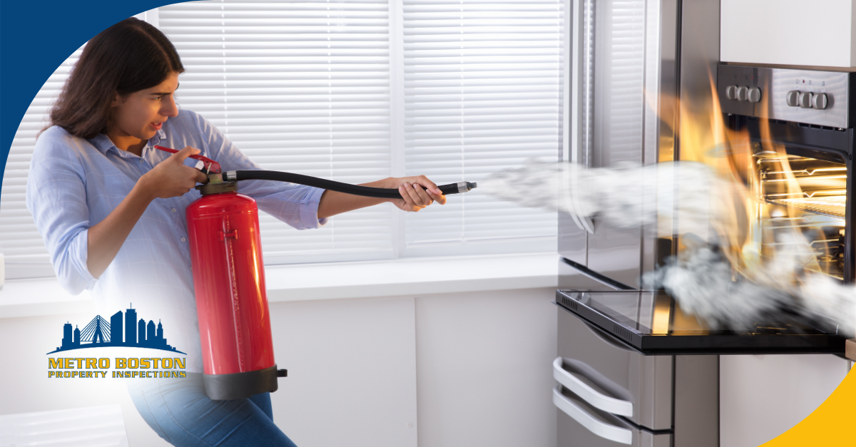 Person using a fire extinguisher to put out a kitchen oven fire