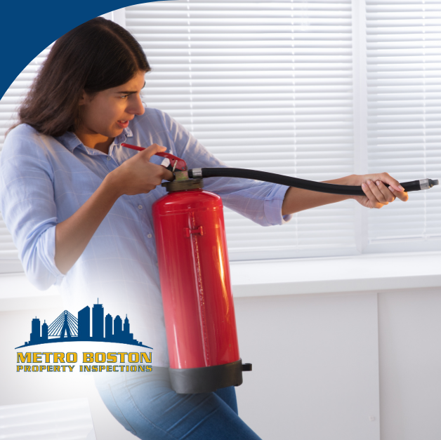 Person using a fire extinguisher to put out a kitchen oven fire