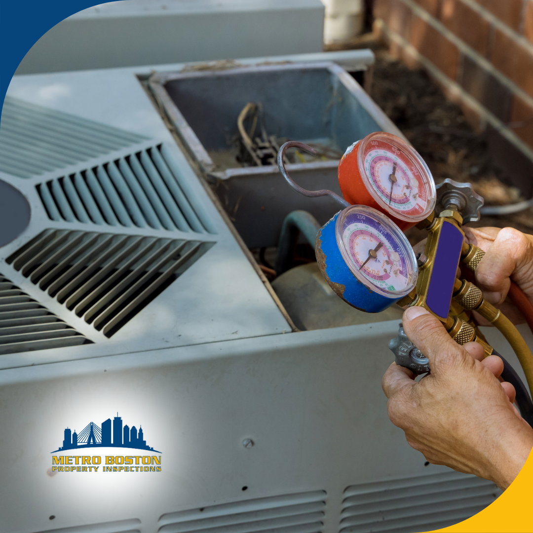 Technician checking HVAC system pressure with colorful gauges outdoors next to a large air conditioning unit and brick wall.