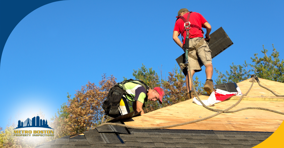 Roof inspectors working on a roof installation with safety gear and equipment.
