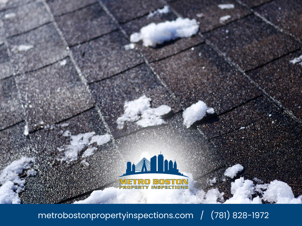 Snow on a roof with clear blue sky.